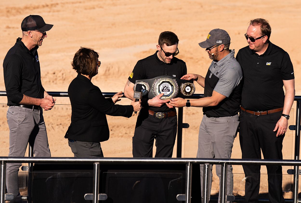 Tom March of Finning UK claims his title belt.