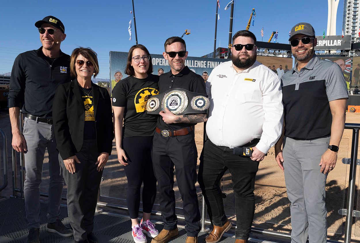 Tom celebrates his victory alongside his support team and Caterpillar senior leaders.
