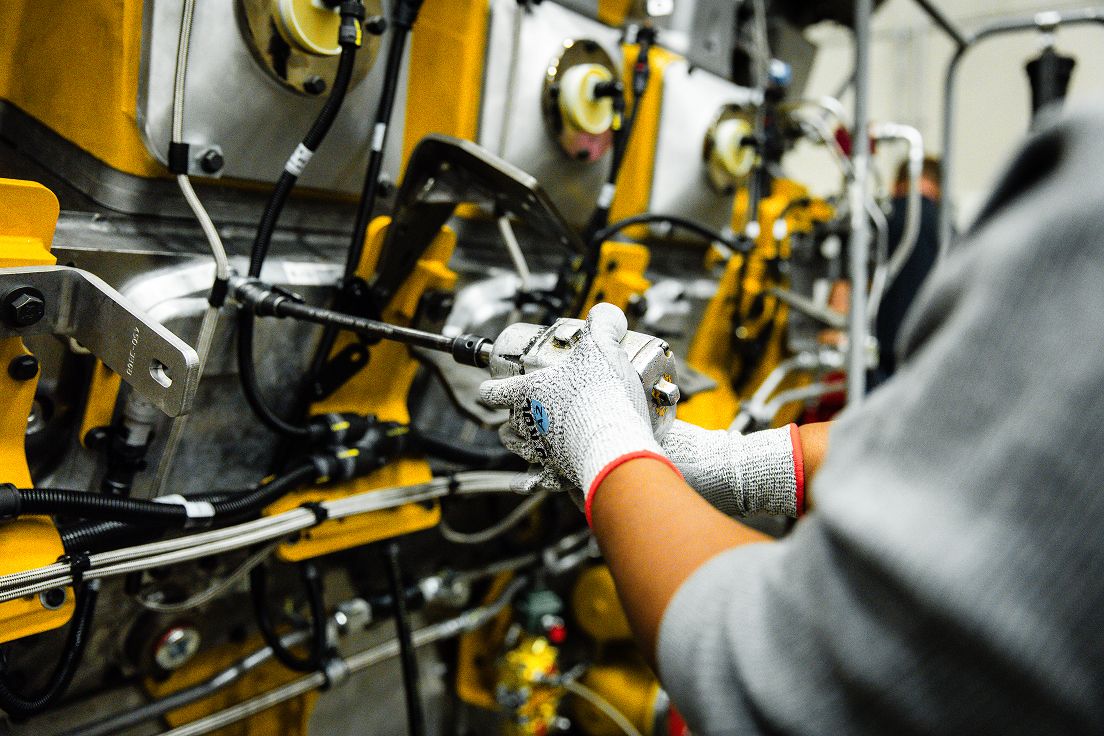 Employee working on an engine
