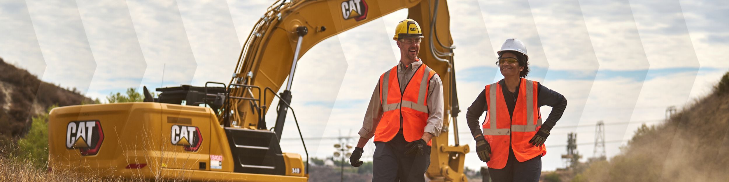 2 operators talking to each other; machine in the background
