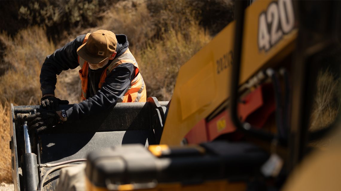 operator adjusting an attachment