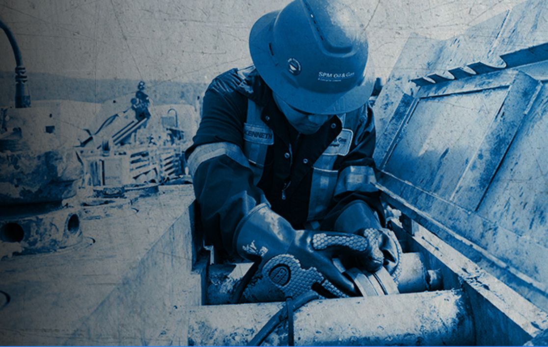 Employee working on a piece of equipment