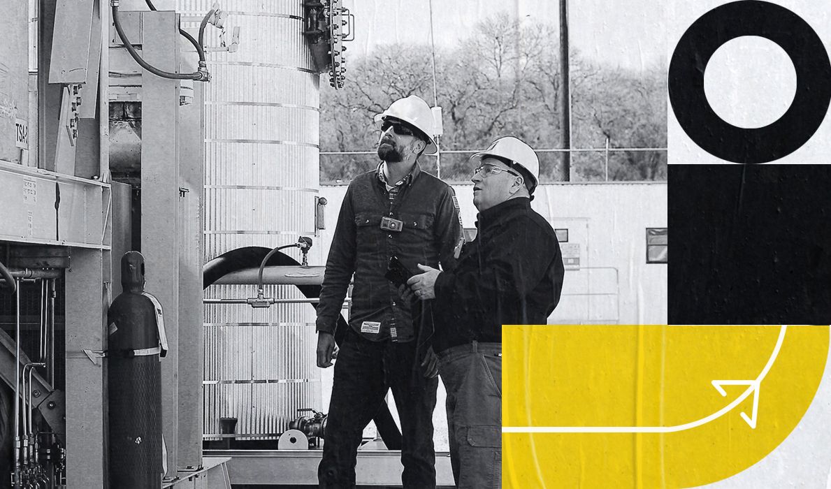 Two employees working in the field