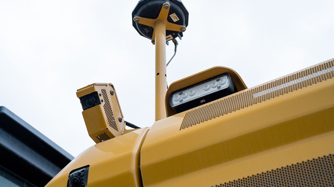 Backup camera and floodlight attachment on Cat equipment