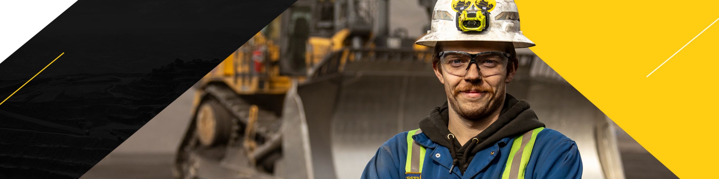 Portrait of a man in front of a Mining machine