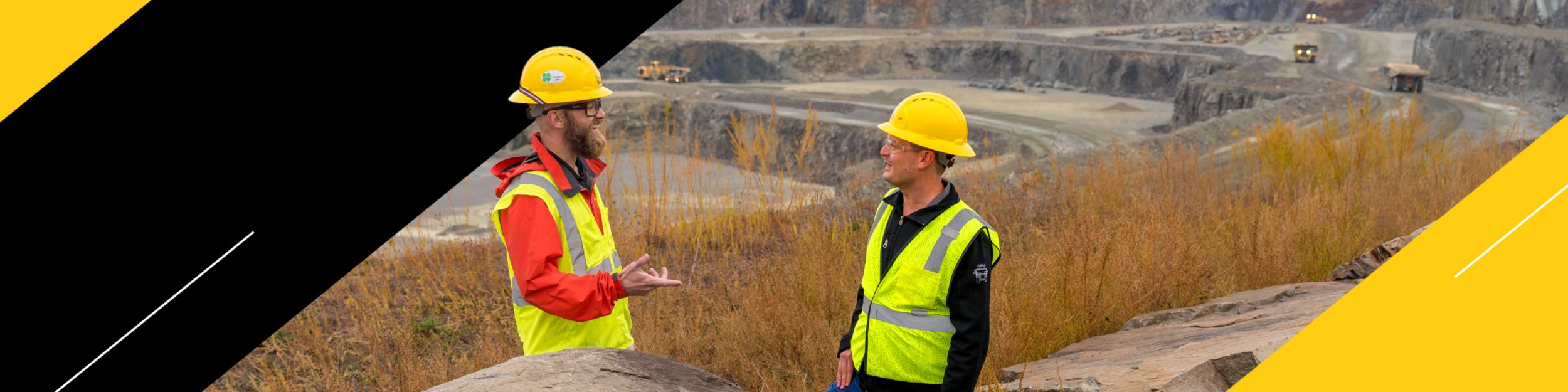 Two People Talking at a Mine Site