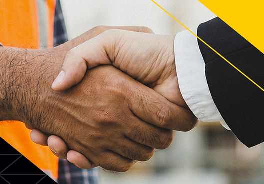An image of two people shaking hands