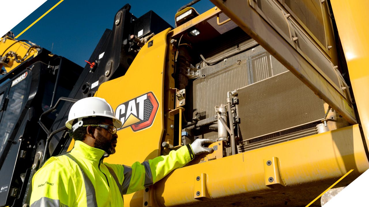 a construction professional inspecting a machine
