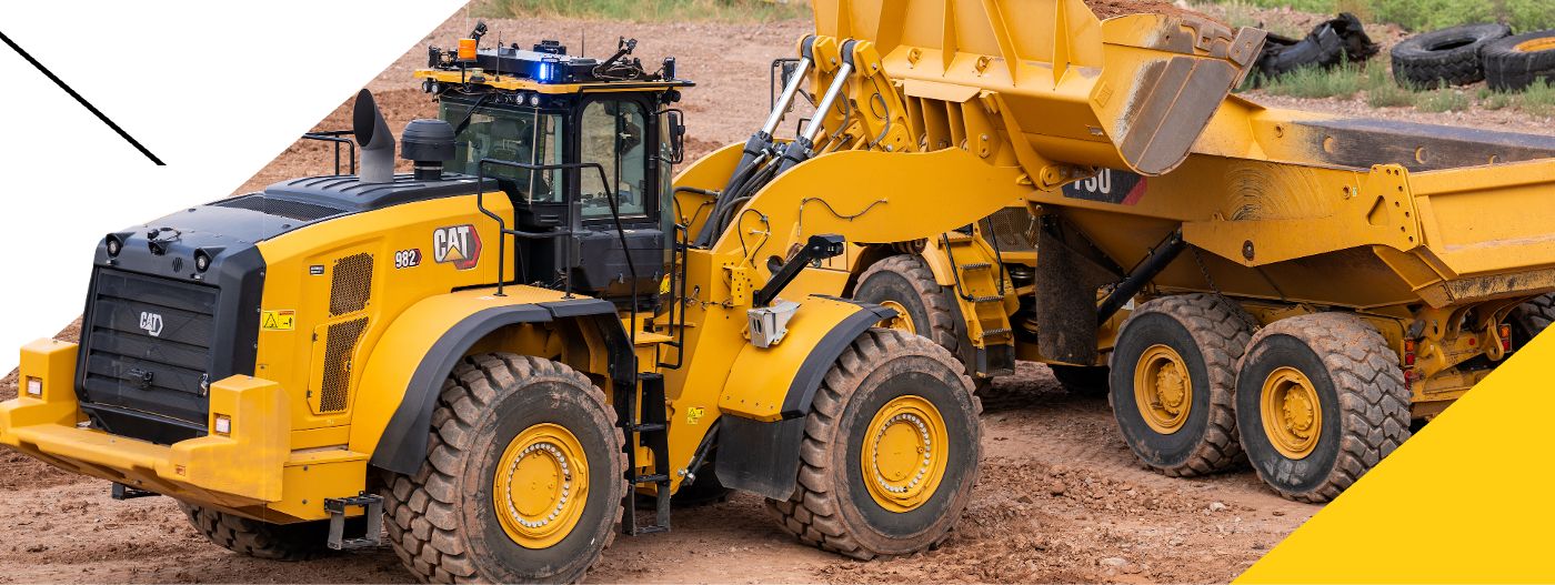 wheel loader emptying bucket into a truck