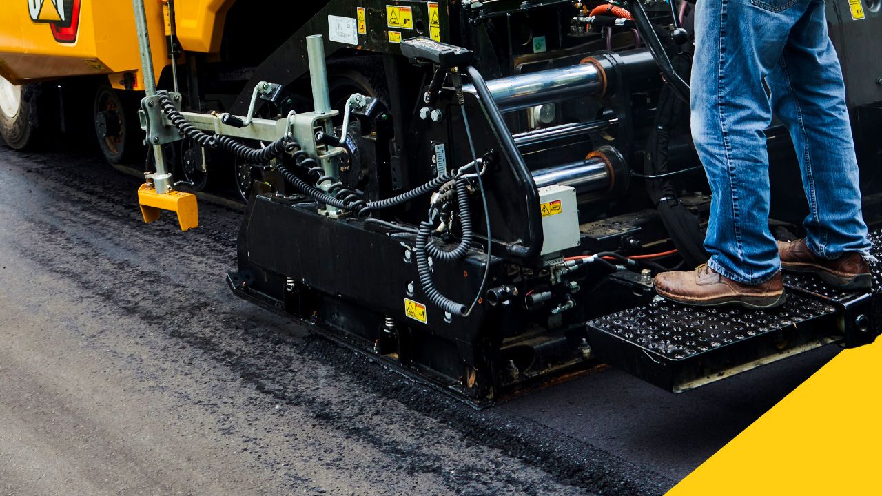 construction professional operating a paving machine