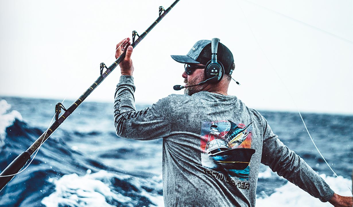 Fisherman on the water with waves splashing