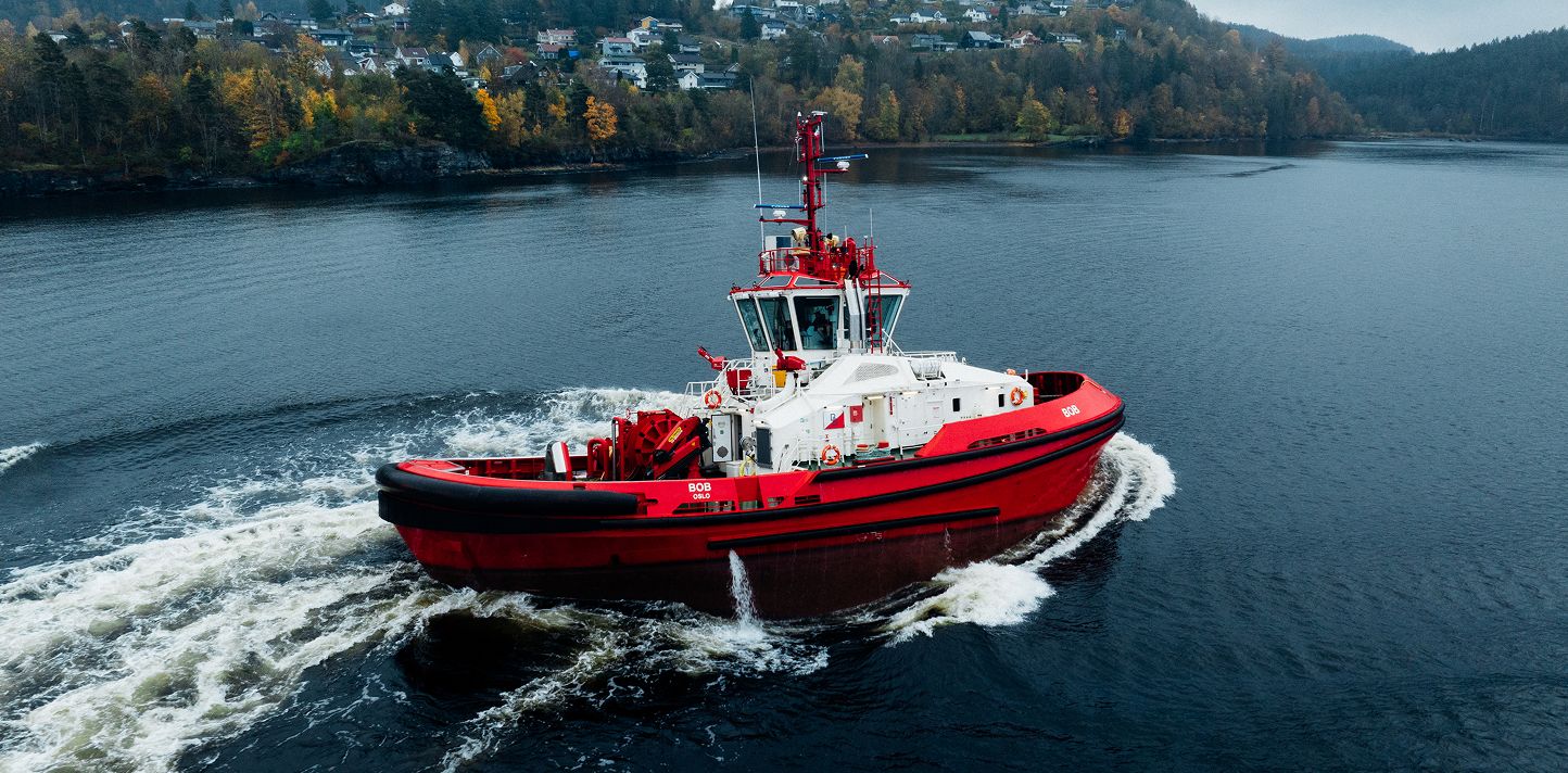 Red vessel moving through the water