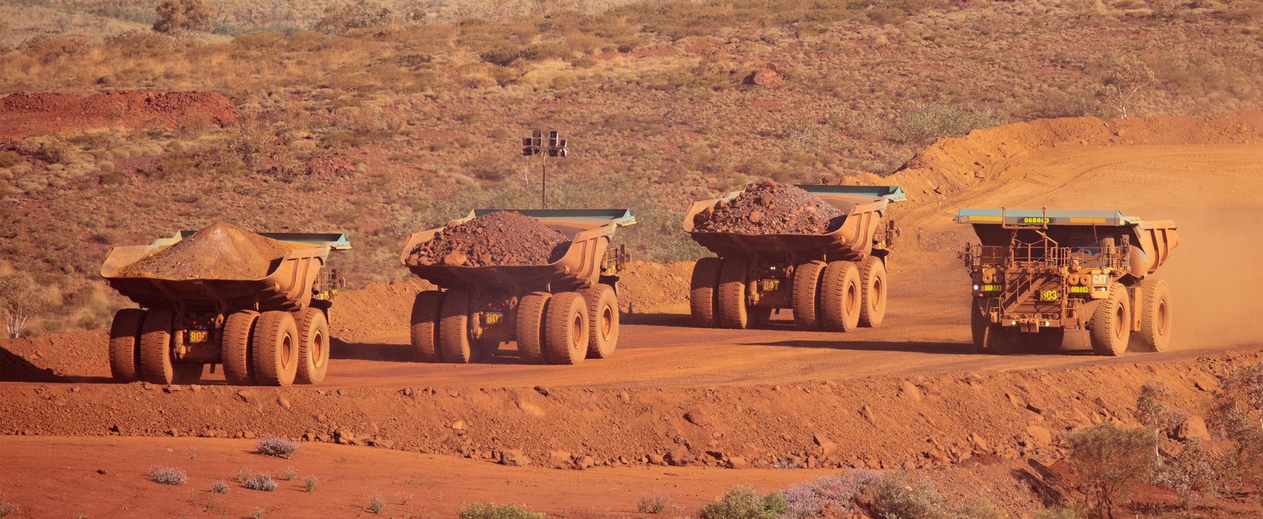 Working Shot of Cat Mining Trucks