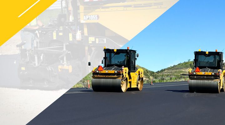 a couple Cat machines paving a freshly laid asphault road