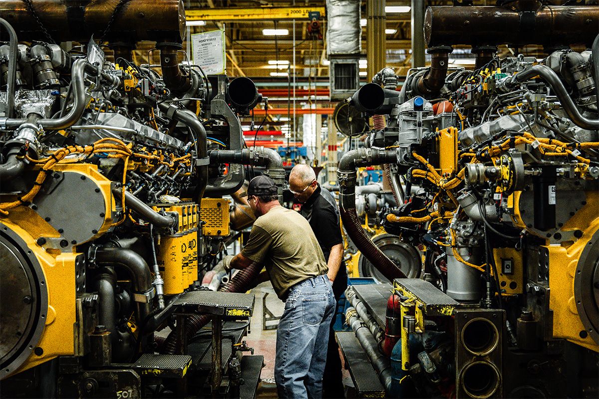 Technicians servicing Cat engines