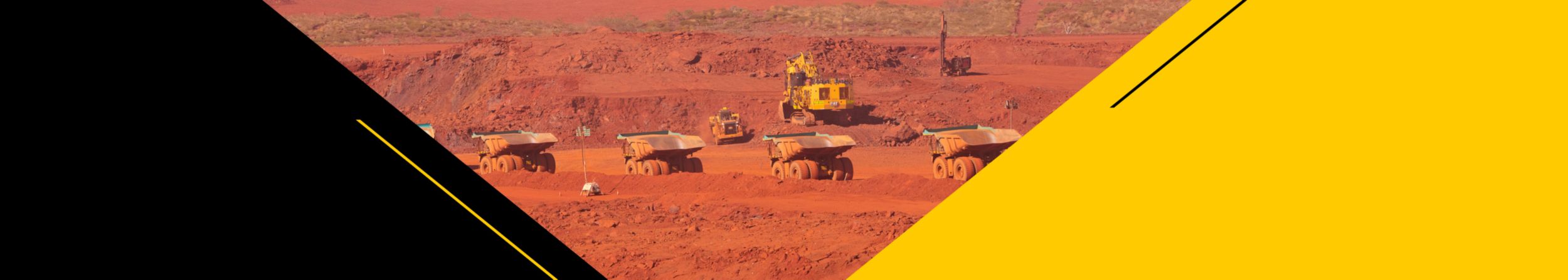 Busy mine site with several trucks on a haul road