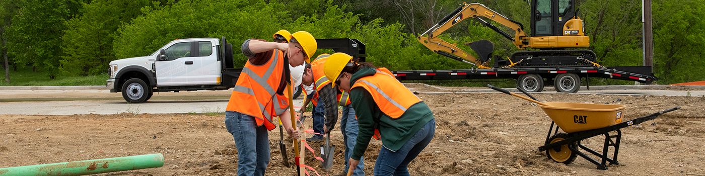 group of people digging a trench
