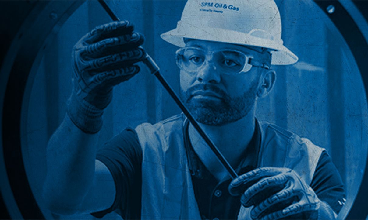 SPM employee working on a well service pump