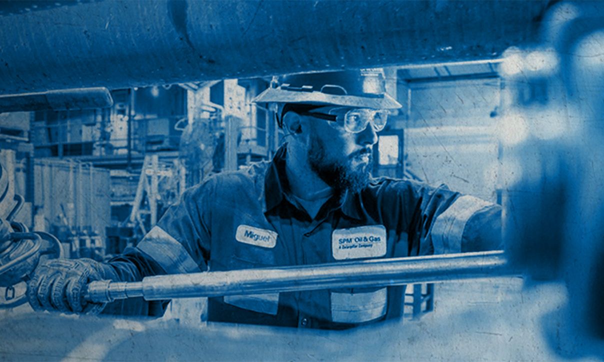 SPM employee working on machinery