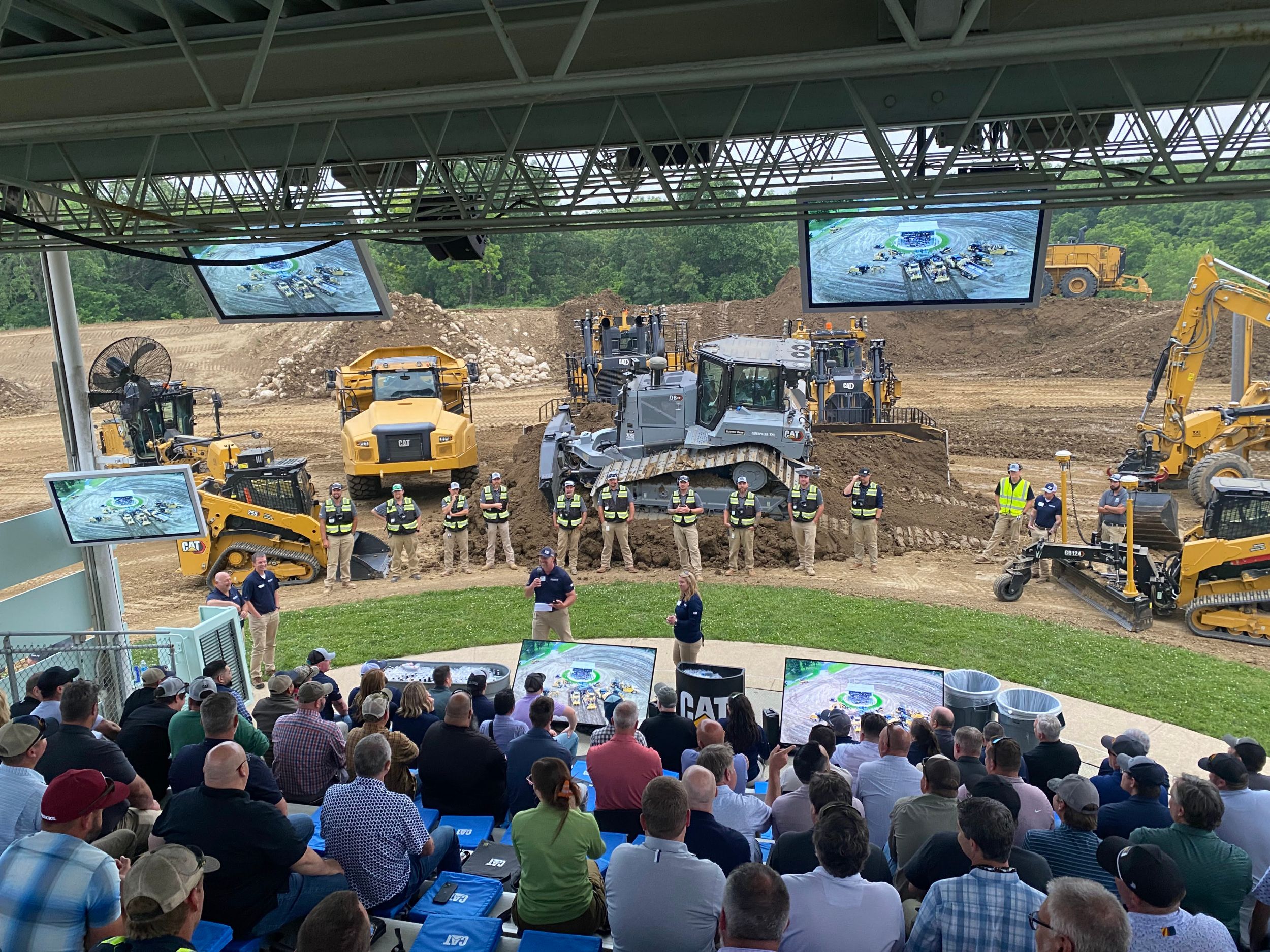 Cat machines being shown to an audience