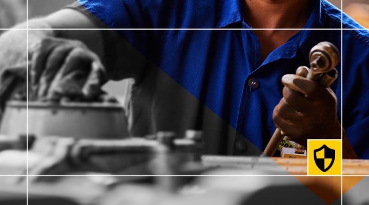 Close-up of a certified Cat technician executing dealer-performed maintenance as part of a Cat Customer Value Agreement. 