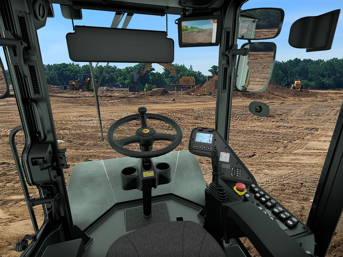 View from the operator station of the Cat CP7 vibratory soil compactor.