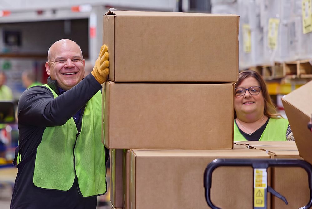 Two people with boxes