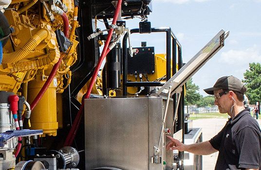 man working on Cat machine