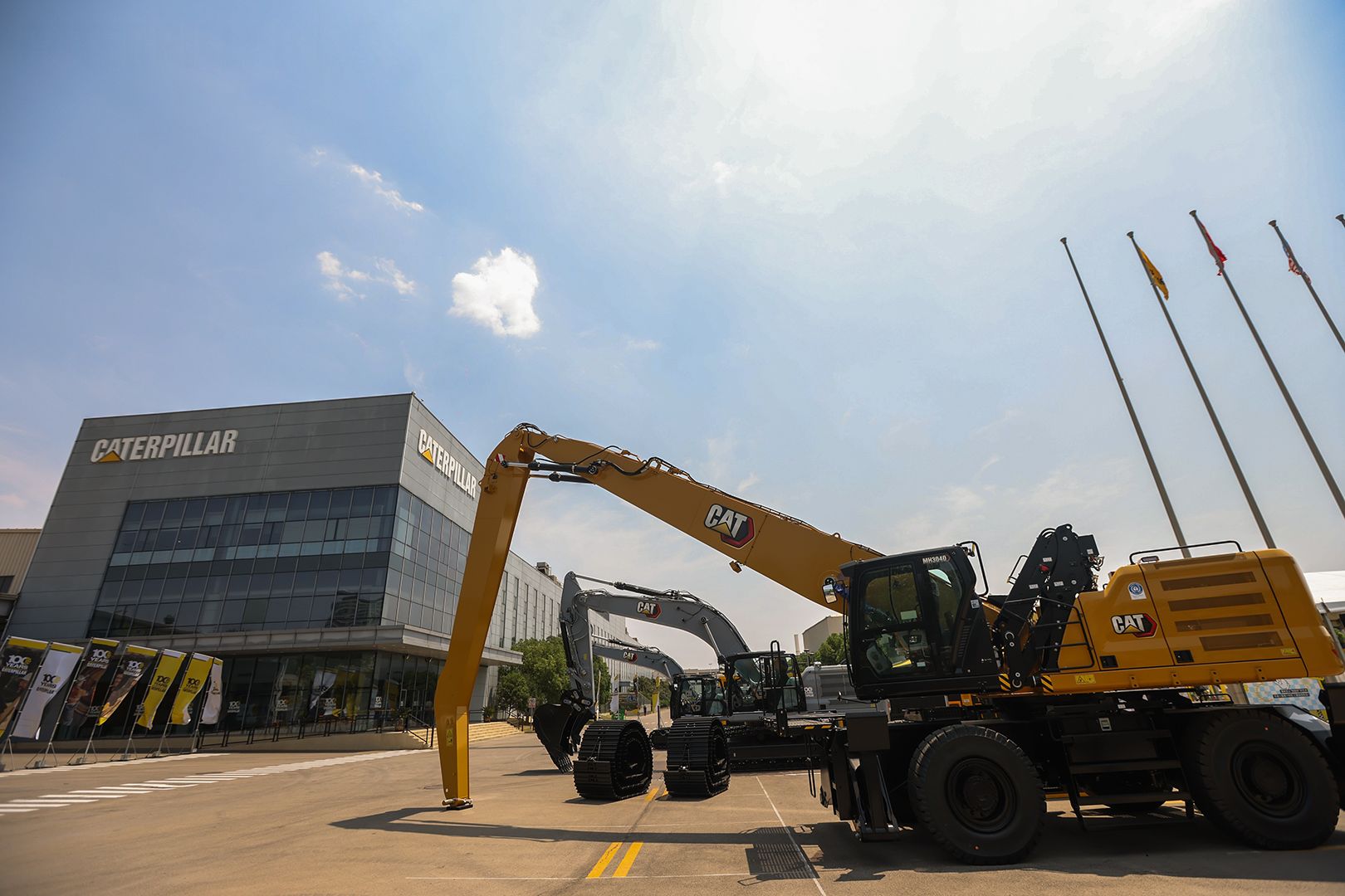 Cat machines in front of a Caterpillar facility in China