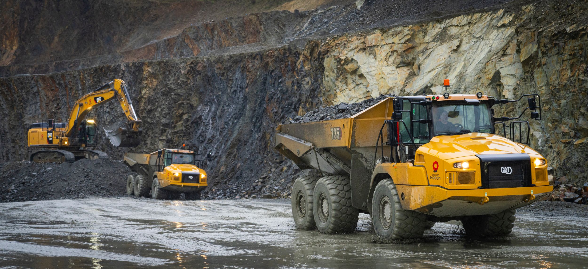 Cat machines operating on open work site