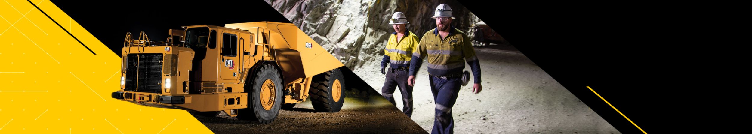 Two men walking in an underground mine