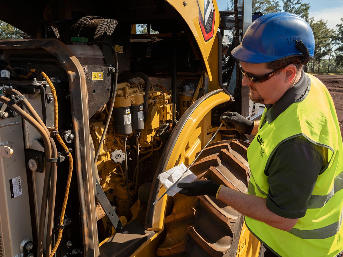 The Cat CP7 padfoot soil compactor is serviced from ground level.