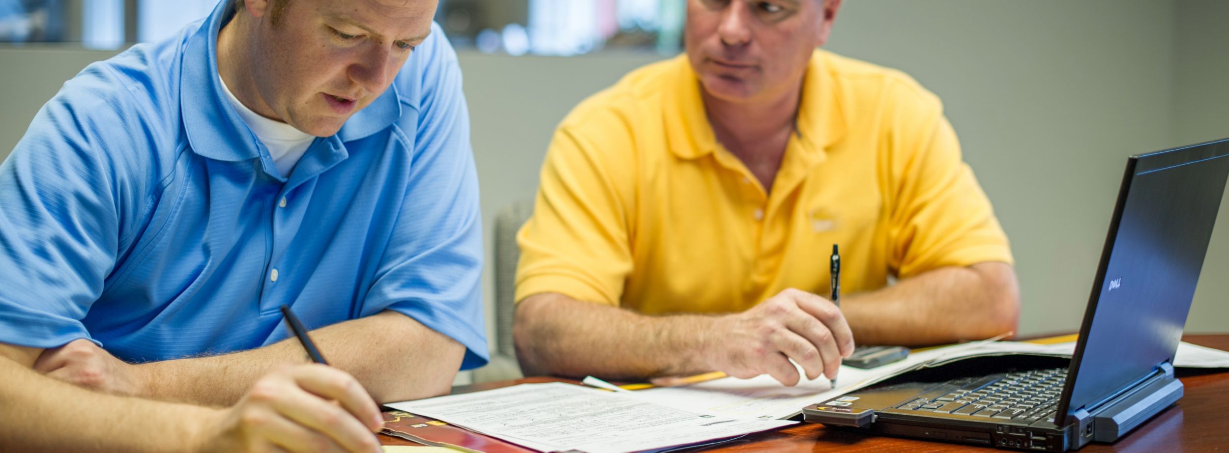 Workers using VisionLink in their office