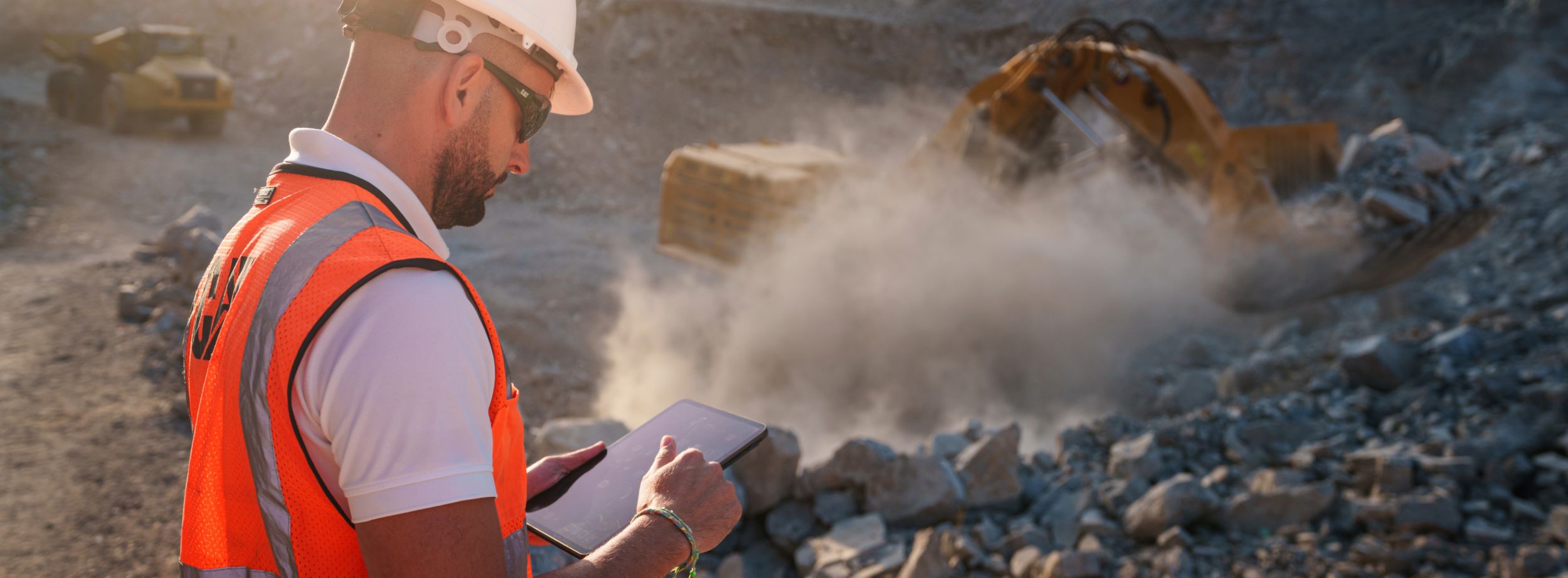 Safety gear worn by construction worker with jobsite in background.