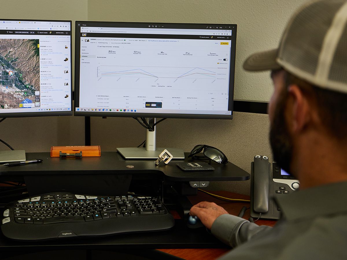 Man viewing VisionLink data on a computer.