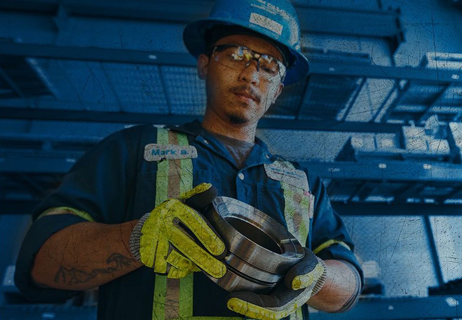 A worker holding a consumable in the warehouse