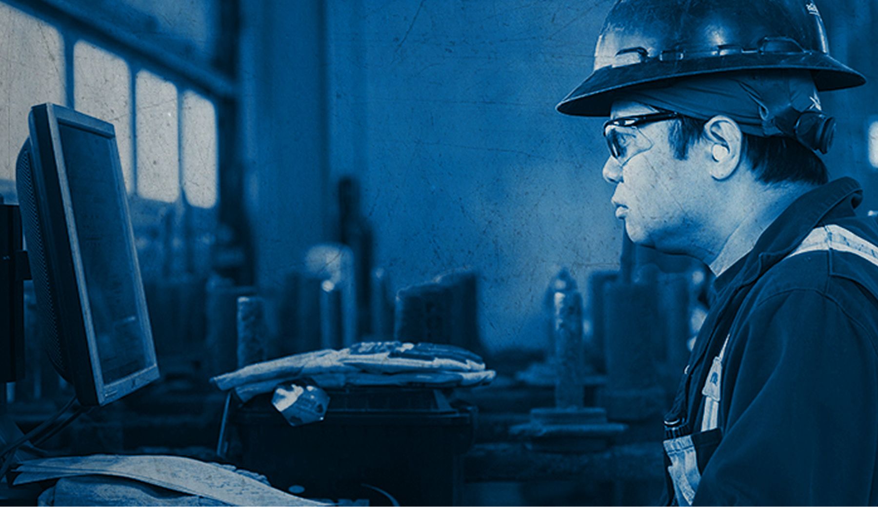 An SPM employee works on a computer