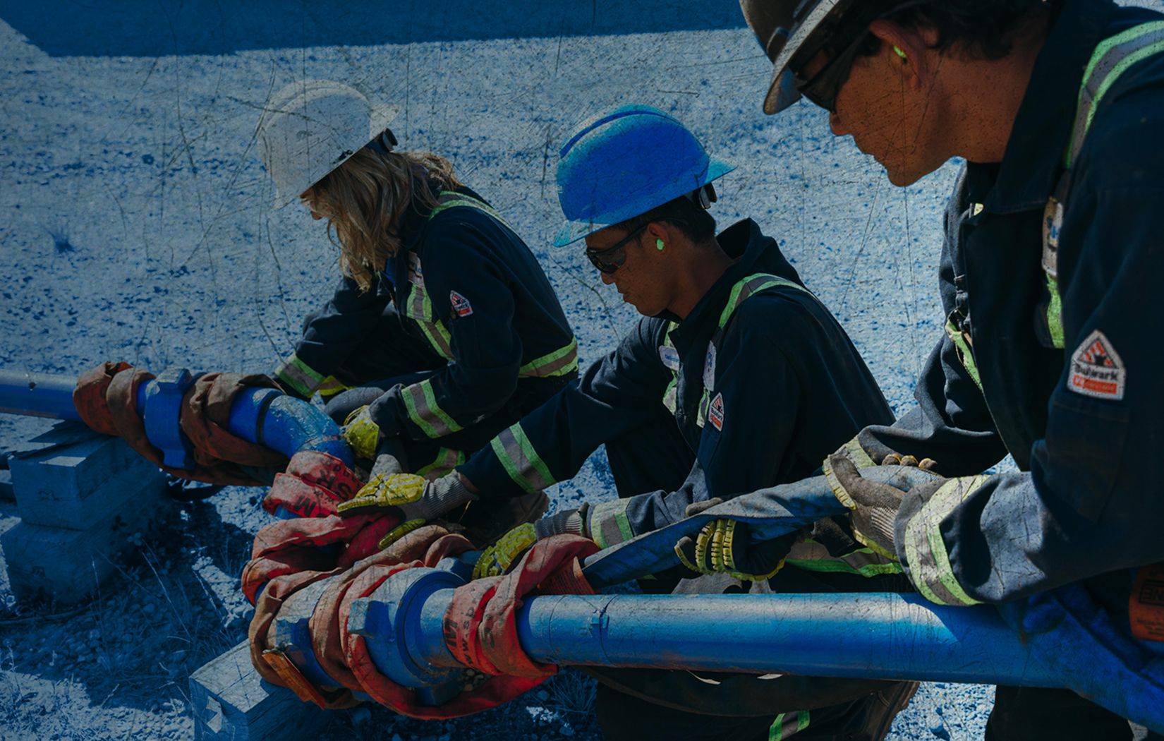 Image with three workers on site