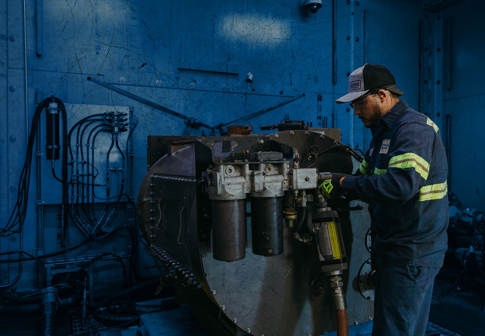 A worker holding a consumable in the warehouse