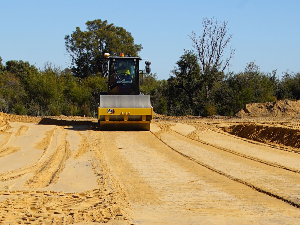 Cat® vibratory soil compactor working on dirt.