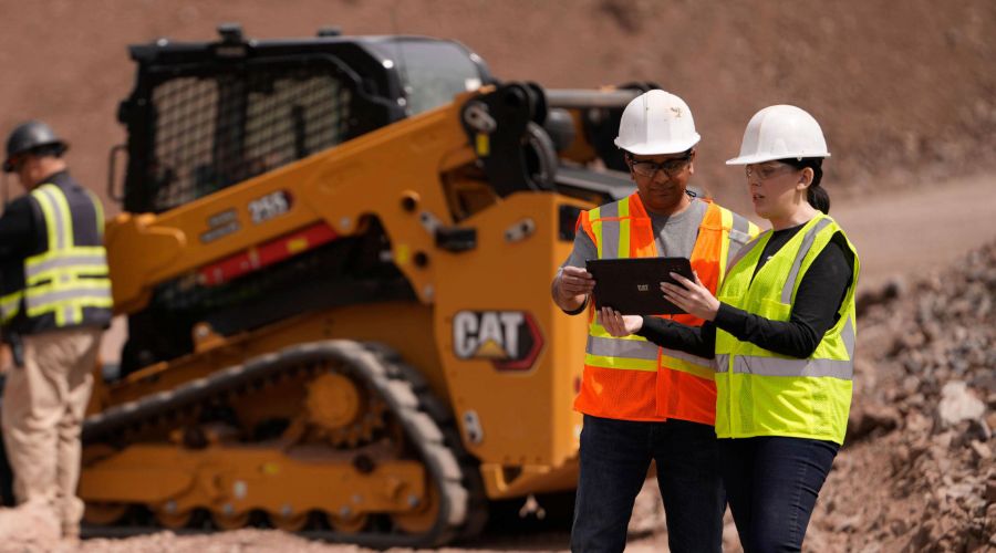 Two people looking at a tablet