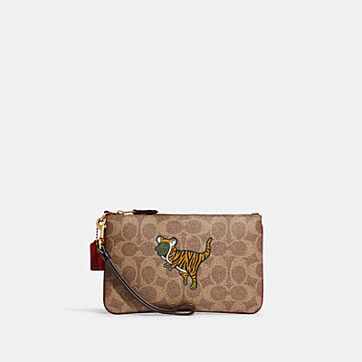 LUNAR NEW YEAR SMALL WRISTLET IN SIGNATURE CANVAS WITH TIGER REXY