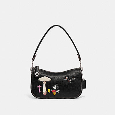 DISNEY X COACH SWINGER 20 IN REGENERATIVE LEATHER WITH MICKEY MOUSE AND MUSHROOM