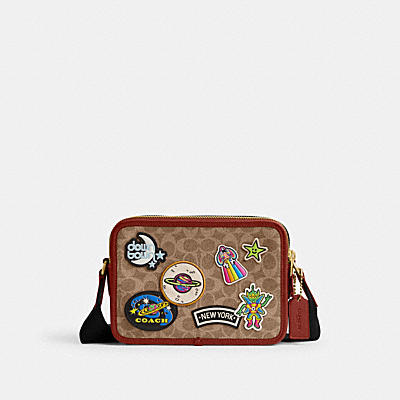 COSMIC COACH CHARTER CROSSBODY 24 IN SIGNATURE CANVAS WITH PATCHES