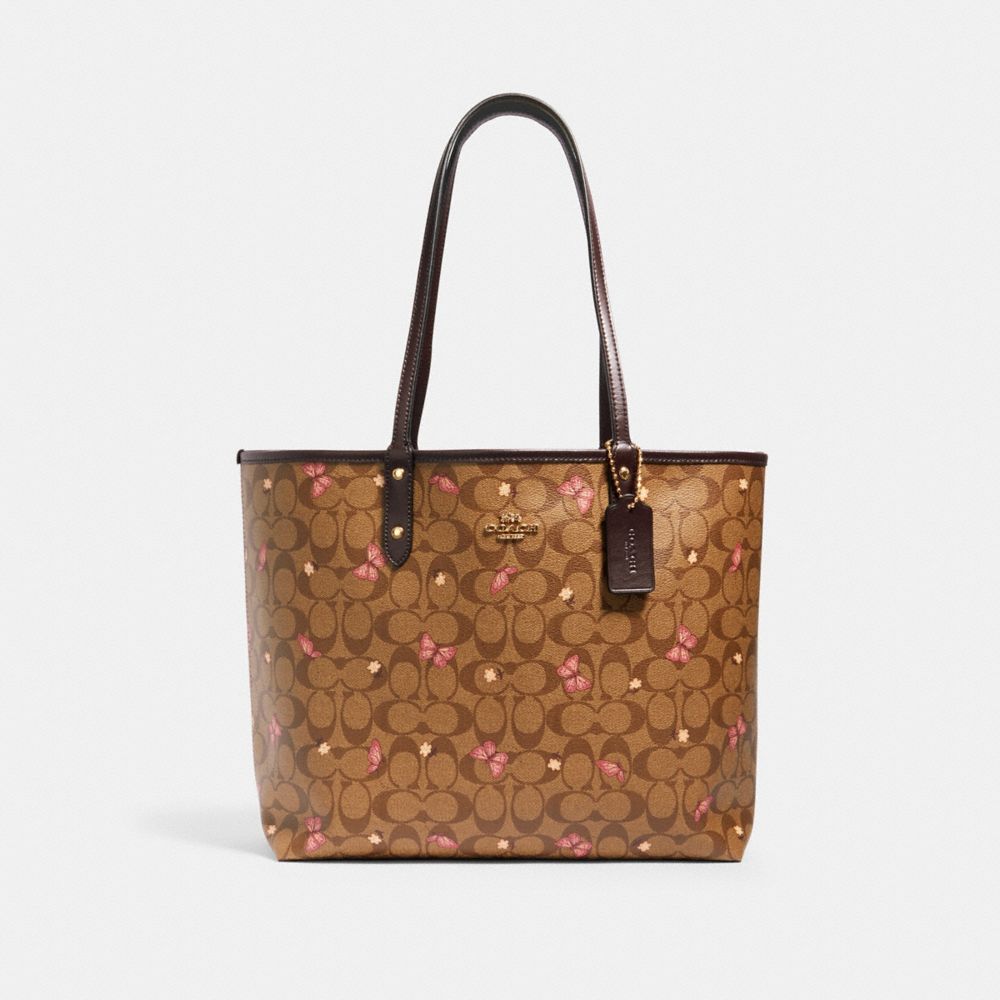 REVERSIBLE CITY TOTE IN SIGNATURE CANVAS WITH BUTTERFLY PRINT - 1461 - IM/KHAKI PINK MULTI/OXBLOOD