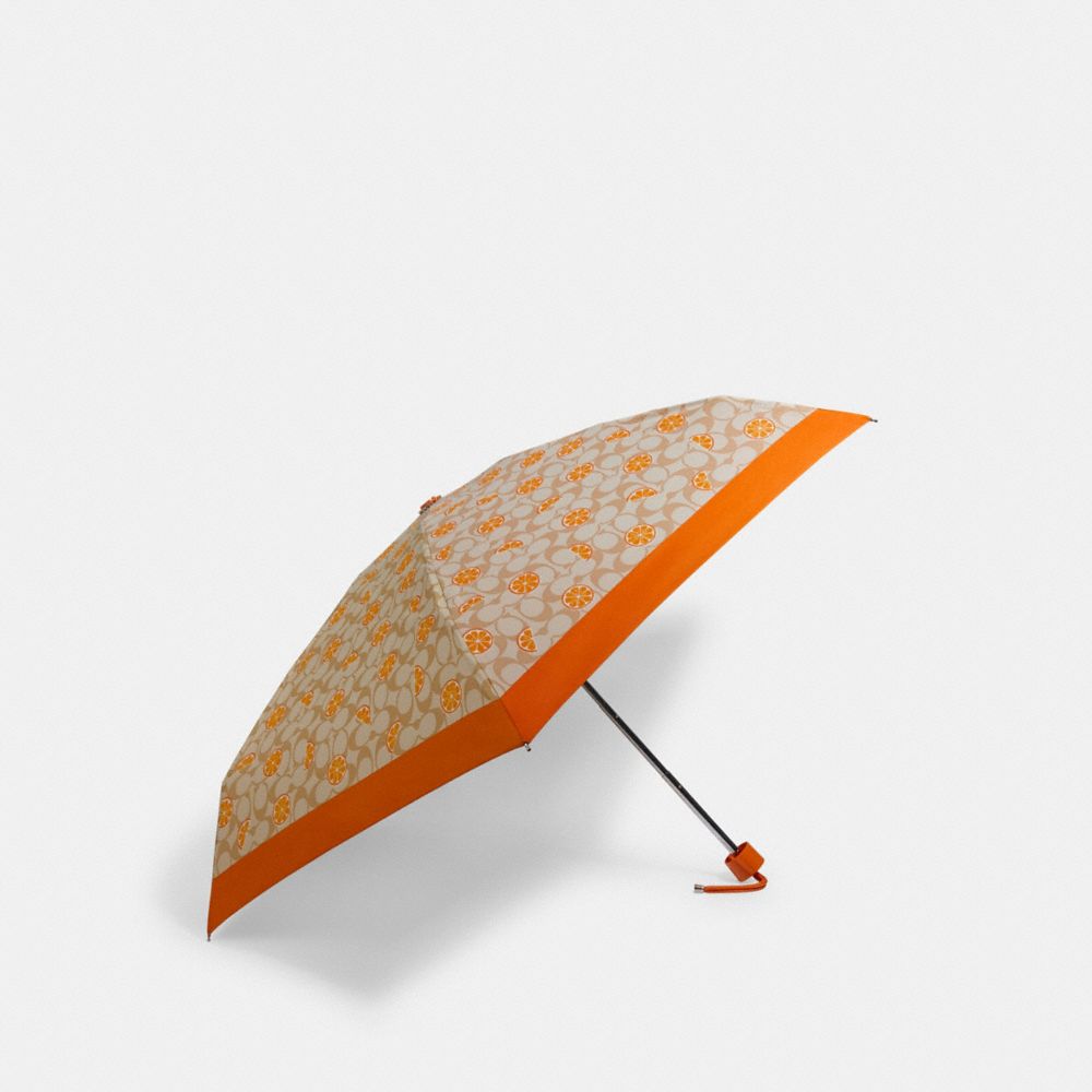 COACH MINI UMBRELLA IN ORANGE SIGNATURE PRINT - SV/LIGHT KHAKI - 1563