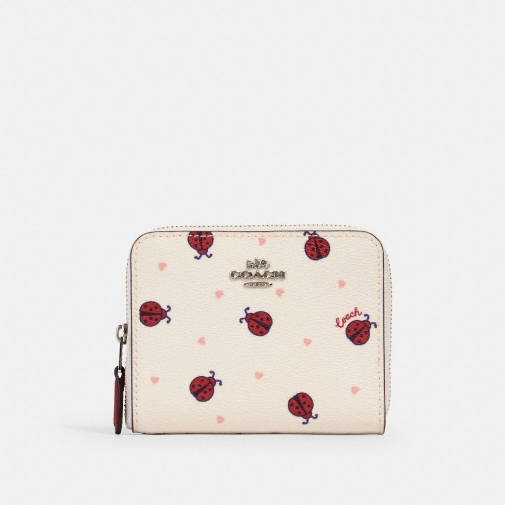 COACH SMALL ZIP AROUND WALLET WITH LADYBUG PRINT - SV/CHALK/ RED MULTI - 2913