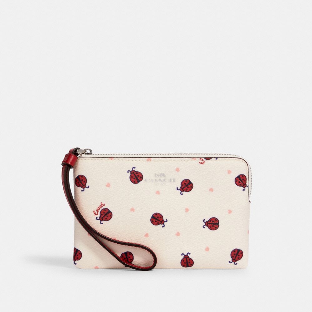 COACH 2970 - CORNER ZIP WRISTLET WITH LADYBUG PRINT SV/CHALK/ RED MULTI