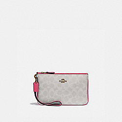 COACH SMALL WRISTLET IN BLOCKED SIGNATURE CANVAS - B4/CHALK CONFETTI PINK - 3050