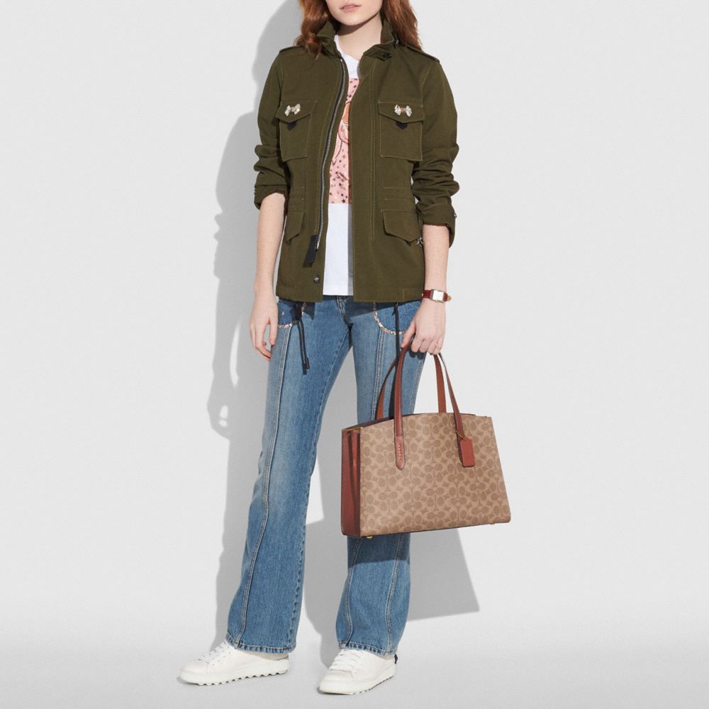 coach charlie carryall in signature canvas